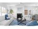 Bright open-plan living room features a fireplace, and elegant decor with hardwood floors and natural light at 3324 Springhaven Ave, Atlanta, GA 30354