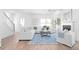 Bright and airy living room featuring hardwood floors, fireplace, and stylish decor at 3324 Springhaven Ave, Atlanta, GA 30354