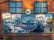 Exterior mural commemorating the history of Hapeville with various images of cars and trains at 3324 Springhaven Ave, Atlanta, GA 30354