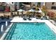 An aerial view of the beautiful pool area, featuring ample lounge seating, umbrellas and multiple water features at 3324 Springhaven Ave, Atlanta, GA 30354