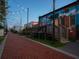Brick walkway lined with string lights and colorful murals, creating a vibrant public space at 3324 Springhaven Ave, Atlanta, GA 30354