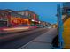 Evening street view with car light trails and visible storefronts along the sidewalk at 3324 Springhaven Ave, Atlanta, GA 30354