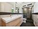 Modern bathroom features double sink vanity and a shower with glass enclosure, providing an elegant space at 1261 Lavista Rd # F-3, Atlanta, GA 30324