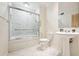 This bathroom features a shower over bath, with glass shower screen and a pedestal sink at 1261 Lavista Rd # F-3, Atlanta, GA 30324