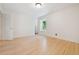 Bright bedroom features hardwood floors and a window, offering a clean, minimalist aesthetic at 1261 Lavista Rd # F-3, Atlanta, GA 30324