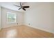 A bright bedroom with hardwood floors and a ceiling fan and a window at 1261 Lavista Rd # F-3, Atlanta, GA 30324