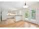 Bright kitchen with white cabinets, stainless appliances, and a seamless transition to the outdoor patio at 1261 Lavista Rd # F-3, Atlanta, GA 30324