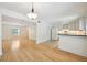 Spacious open concept showcasing hardwood floors connecting kitchen, dining, and living areas at 1261 Lavista Rd # F-3, Atlanta, GA 30324