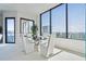 Modern dining area with floor-to-ceiling windows offering stunning city views at 2828 Peachtree Nw Rd # 2002, Atlanta, GA 30305