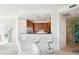 Bright open kitchen with stainless steel appliances and sleek bar seating at 2828 Peachtree Nw Rd # 2002, Atlanta, GA 30305
