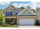 Beautiful two-story home with brick accents, a two-car garage, and a manicured front lawn at 160 Avery Landing Way, Canton, GA 30115