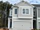 Charming two-story home with a gray facade, a two-car garage, and a well-maintained lawn at 5174 Longview Run, Decatur, GA 30035