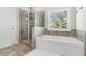 Bathroom boasts a large soaking tub and walk-in shower at 2535 Grayton Loop, Villa Rica, GA 30180