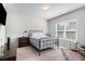 Bright bedroom featuring a metal bed frame and ample natural light at 2535 Grayton Loop, Villa Rica, GA 30180