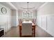 Dining room with hardwood floors, chandelier, and farmhouse table at 2535 Grayton Loop, Villa Rica, GA 30180