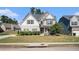 Two-story house with gray siding, stone accents, and a landscaped lawn at 2535 Grayton Loop, Villa Rica, GA 30180