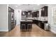 Kitchen with dark cabinets, granite counters, and stainless steel appliances at 2535 Grayton Loop, Villa Rica, GA 30180