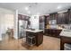 Spacious kitchen with island, stainless steel appliances, and dark wood cabinetry at 2535 Grayton Loop, Villa Rica, GA 30180