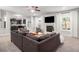 Spacious living room with sectional sofa, fireplace, and hardwood floors at 2535 Grayton Loop, Villa Rica, GA 30180