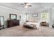 Main bedroom features a large bed, dresser and access to the bathroom at 2535 Grayton Loop, Villa Rica, GA 30180