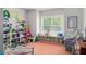 Fun playroom with colorful storage, toys, and a comfy seating area at 2535 Grayton Loop, Villa Rica, GA 30180