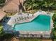 Community pool featuring lounge chairs, tables, and a black fence surrounding the perimeter at 3805 Stonewall Se Ter # 3805, Atlanta, GA 30339