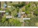 Covington, GA property featuring a home, barn, wood shed, covered patio, and detached garage all surrounded by lush trees at 3208 Paddock Rd, Covington, GA 30014