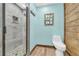 The bathroom features a tiled shower, toilet, and stylish decor at 3208 Paddock Rd, Covington, GA 30014