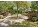 Beautifully landscaped property with a log cabin home and a detached garage, offering charm and convenience at 3208 Paddock Rd, Covington, GA 30014