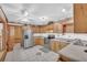 Bright kitchen with stainless steel refrigerator, tile floors, and ample counter space at 3208 Paddock Rd, Covington, GA 30014