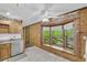 Spacious eat-in kitchen features a bay window overlooking the lush, green yard at 3208 Paddock Rd, Covington, GA 30014