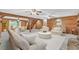 Inviting living room with wood walls, a cozy seating area, and a staircase leading to the upper level at 3208 Paddock Rd, Covington, GA 30014