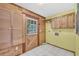 Mud room with built in storage, wood door and tile floor at 3208 Paddock Rd, Covington, GA 30014