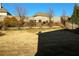 A large back yard includes new plantings, trees and a wooden fence at 2616 Holden Spring Dr, Dacula, GA 30019