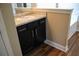 Bathroom vanity with dark cabinets, light countertop, and stylish wood flooring at 2616 Holden Spring Dr, Dacula, GA 30019