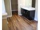 Bright bathroom with wood floors, vanity, and access to a walk-in closet at 2616 Holden Spring Dr, Dacula, GA 30019