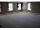 A spacious bedroom with neutral carpeting, neutral paint, and plenty of natural light at 2616 Holden Spring Dr, Dacula, GA 30019