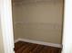 Walk-in closet with wood floors and white wire shelving for maximum storage at 2616 Holden Spring Dr, Dacula, GA 30019