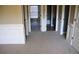 Hallway area featuring plush carpet and white wainscoting at 2616 Holden Spring Dr, Dacula, GA 30019