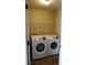 A functional laundry room features a Samsung washer and dryer and wire shelving at 2616 Holden Spring Dr, Dacula, GA 30019