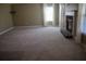 Living room features carpet, a fireplace, and natural light from large windows at 2616 Holden Spring Dr, Dacula, GA 30019