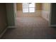 This spacious living room features chair rail molding, neutral paint, and large windows at 2616 Holden Spring Dr, Dacula, GA 30019