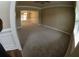 The living room is well lit with natural light and leads to a dining room at 2616 Holden Spring Dr, Dacula, GA 30019