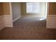 Room featuring neutral walls, carpet, and lots of sunlight, ideal for a play or study area at 2616 Holden Spring Dr, Dacula, GA 30019