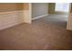 Spacious room featuring neutral walls, carpet, and lots of sunlight, ideal for a play or study area at 2616 Holden Spring Dr, Dacula, GA 30019