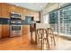 Modern kitchen with stainless steel appliances, sleek cabinetry, and hardwood floors at 923 Peachtree Ne St # 927, Atlanta, GA 30309