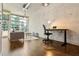 Open living space featuring a desk, modern lighting, and floor to ceiling windows at 923 Peachtree Ne St # 927, Atlanta, GA 30309