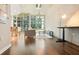 Open living space featuring a desk, modern lighting, and floor to ceiling windows at 923 Peachtree Ne St # 927, Atlanta, GA 30309