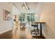 Open living space featuring a work space, kitchen, and floor to ceiling windows at 923 Peachtree Ne St # 927, Atlanta, GA 30309