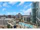Breathtaking rooftop pool and an aerial view of the city skyline under a beautiful sky with clouds at 1065 Peachtree Ne St # 3003, Atlanta, GA 30309